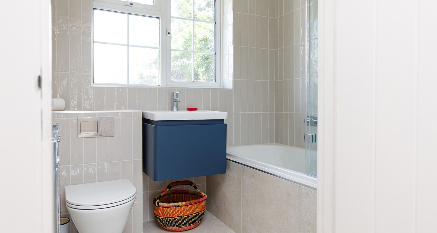 Upstairs the family bathroom is now very modern and the wall hung sink cupboard gives the illusion of more space