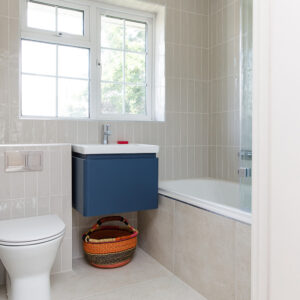 Upstairs the family bathroom is now very modern and the wall hung sink cupboard gives the illusion of more space