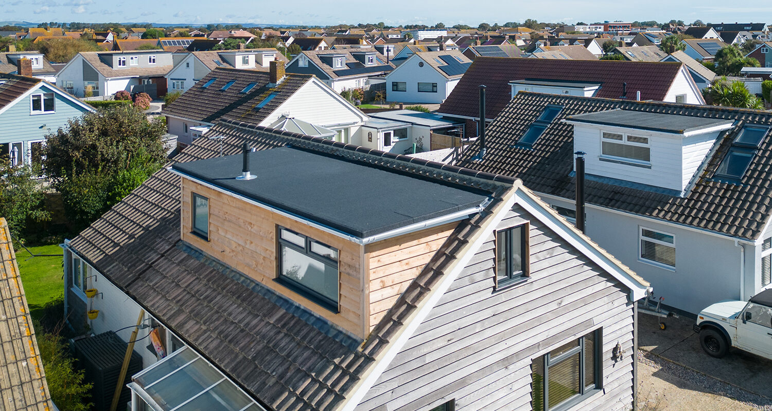 The existing dormer joins seamlessly to the new dormer and new roofing felt across the entire new flat roof