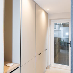 Floor to ceiling cupboards in the utility for maximum storage