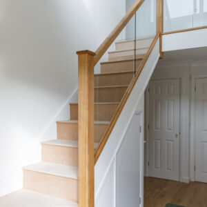 Glass balustrade helps fill the hallway with lots of light
