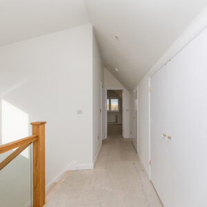 Storage cupboards line the hallway