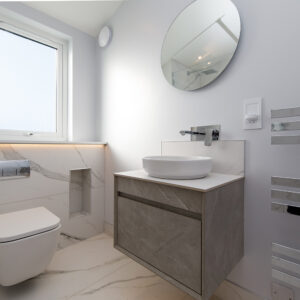 Wall hung vanity and toilet help create a vision of space