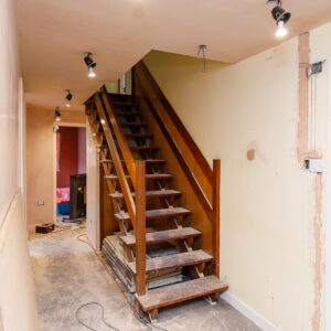 The original staircase will be painted and the treads wrapped in rubber.