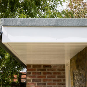 A feature overhang from the roof creates a nice cover to the entrance seating area