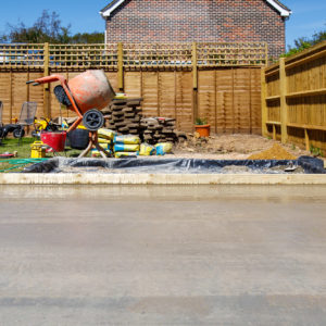 Patio area with artificial grass in the corner to go under trampoline