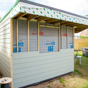 There is a 1m clearance around the garden room, leaving space for storage and planting.