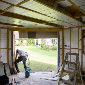 A large sliding door opens out onto the garden. We will fit a vinyl floor in here which will be touch and hard wearing for the home gym equipment.