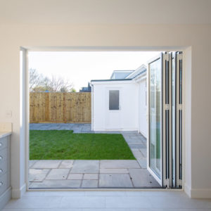 Bifold doors open up the space and allow a seamless flow onto the new patio area